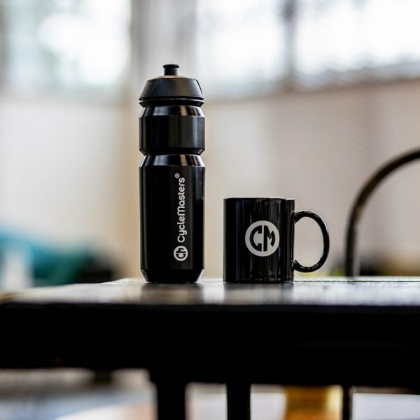 A black CycleMasters bottle and mug