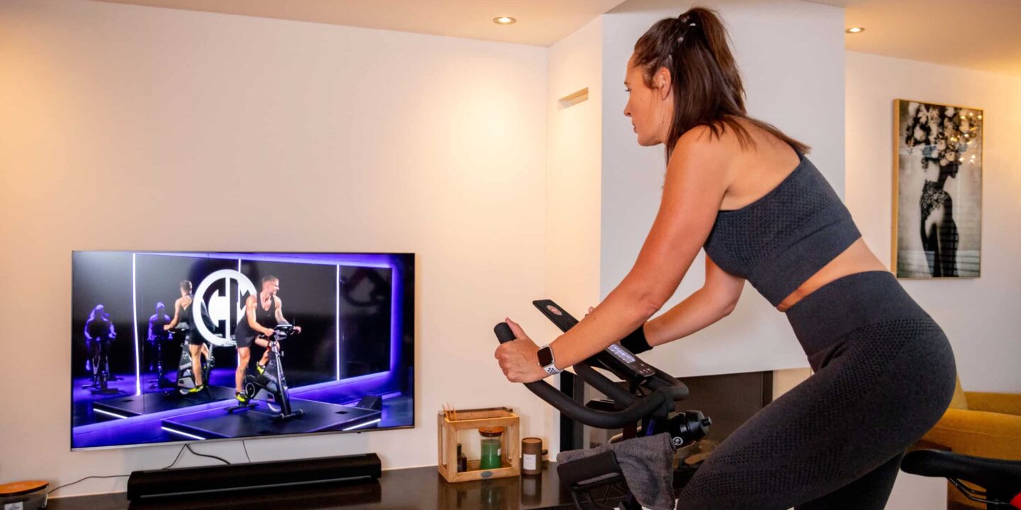Woman does a spinning workout on her bike