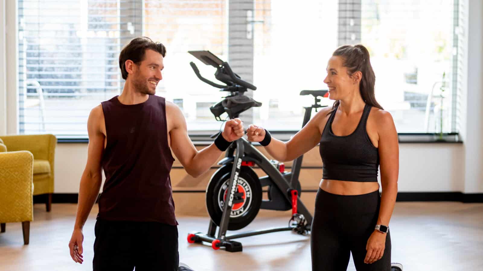 Couple working out with CycleMasters at home